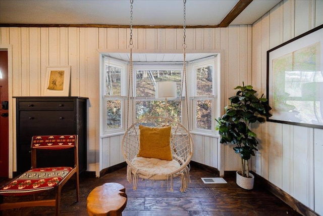 sitting room with beam ceiling