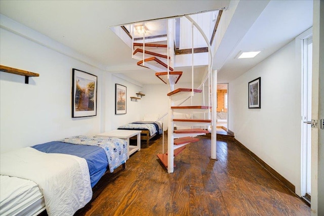 bedroom with dark hardwood / wood-style flooring