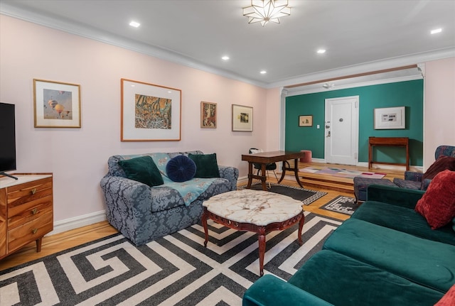 living room featuring hardwood / wood-style floors and ornamental molding