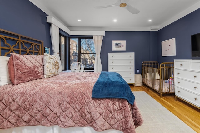 bedroom featuring ceiling fan and light wood-type flooring