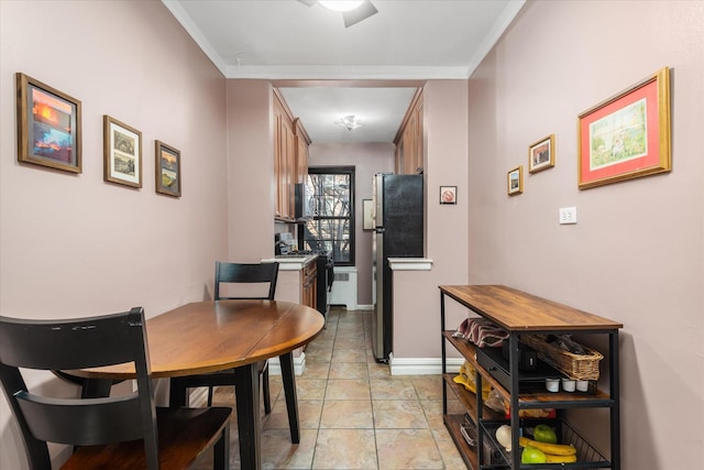 dining space featuring ornamental molding