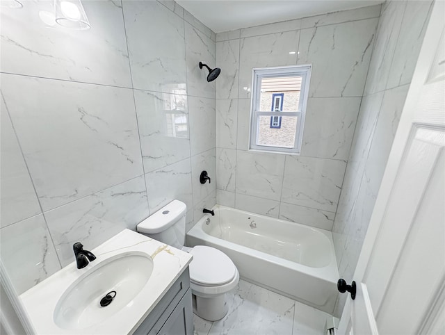 full bathroom featuring tiled shower / bath, vanity, and toilet