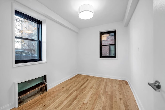 spare room featuring hardwood / wood-style floors