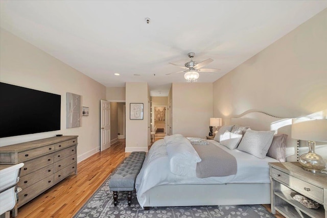 bedroom with ceiling fan and light wood-type flooring