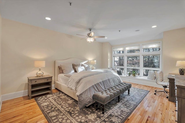 bedroom featuring ceiling fan and light hardwood / wood-style flooring