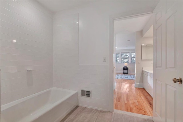 bathroom with vanity and hardwood / wood-style floors