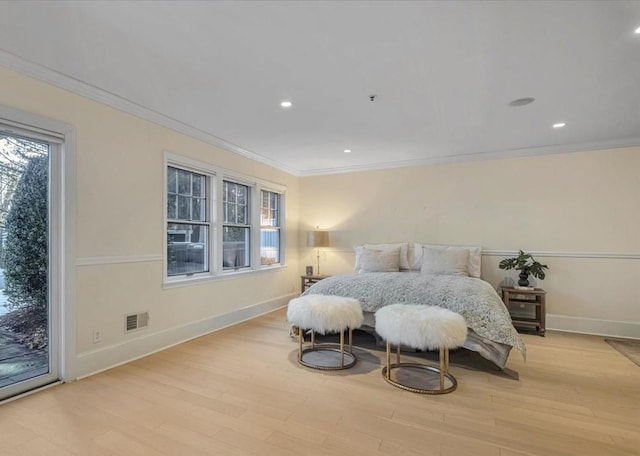 bedroom featuring access to exterior, light hardwood / wood-style flooring, and ornamental molding