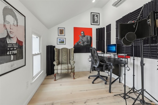 office with wood-type flooring, vaulted ceiling, and a wall unit AC