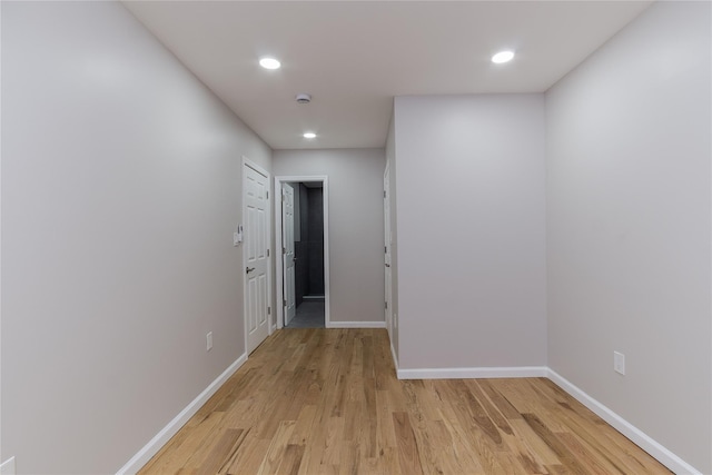 corridor with light wood-type flooring