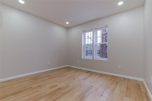 empty room with light wood-type flooring