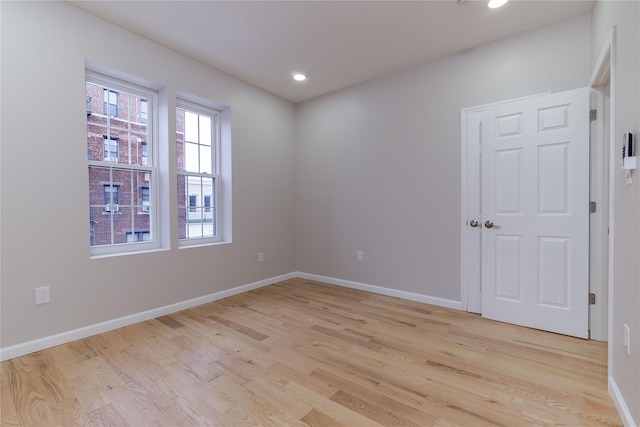 unfurnished room featuring light hardwood / wood-style flooring