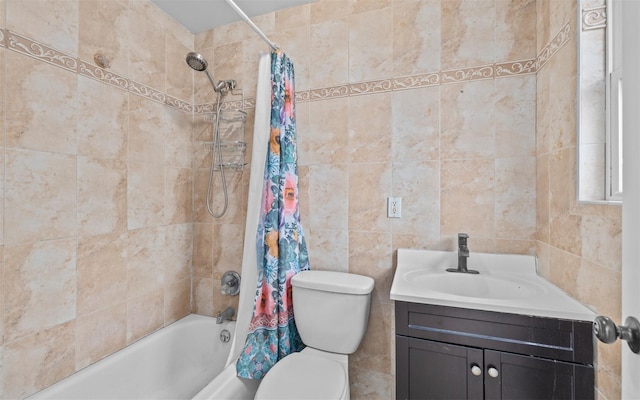 full bathroom featuring tile walls, toilet, vanity, and shower / bath combination with curtain