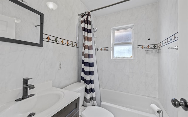 full bathroom featuring vanity, toilet, tile walls, and shower / tub combo with curtain