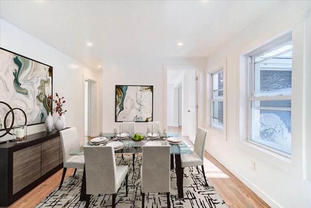 dining area featuring light wood-type flooring