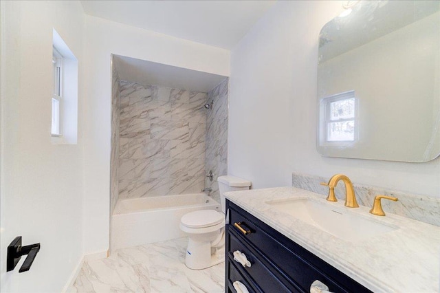 full bathroom with vanity, toilet, and tiled shower / bath