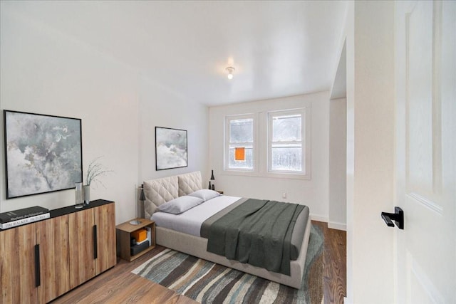 bedroom with hardwood / wood-style floors