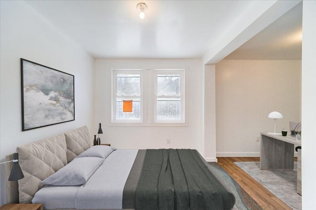 bedroom featuring wood-type flooring