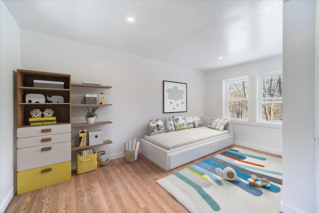 bedroom with light hardwood / wood-style flooring