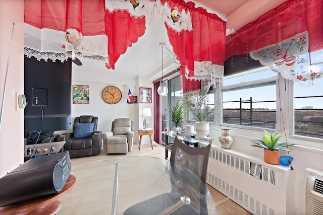 tiled living room featuring radiator heating unit