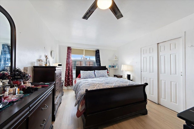 bedroom featuring ceiling fan, light wood-type flooring, and a closet