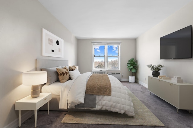 bedroom with dark colored carpet