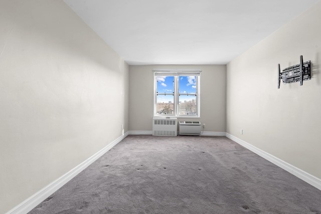 unfurnished room with carpet floors and radiator