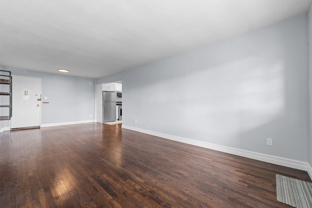 unfurnished living room with dark hardwood / wood-style flooring