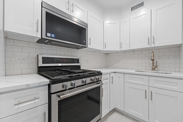 kitchen featuring white cabinets and stainless steel appliances