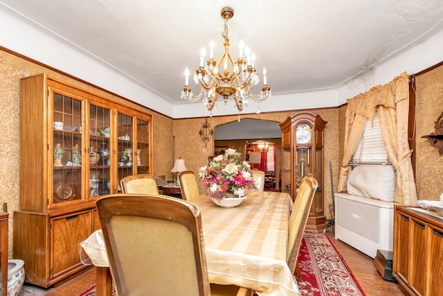 dining space featuring an inviting chandelier