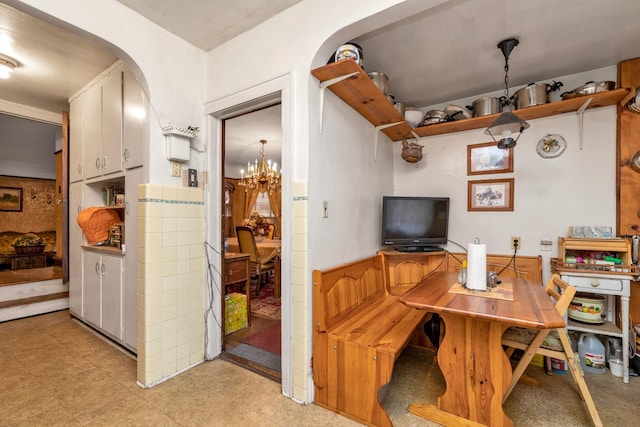 office featuring an inviting chandelier