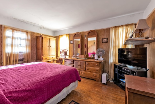 bedroom with hardwood / wood-style floors