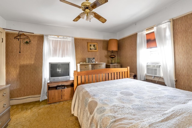 bedroom featuring ceiling fan, cooling unit, and light colored carpet