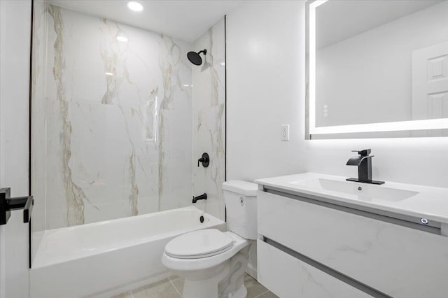 full bathroom with tile patterned floors, vanity, toilet, and tiled shower / bath