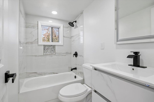 full bathroom featuring vanity, toilet, and tiled shower / bath