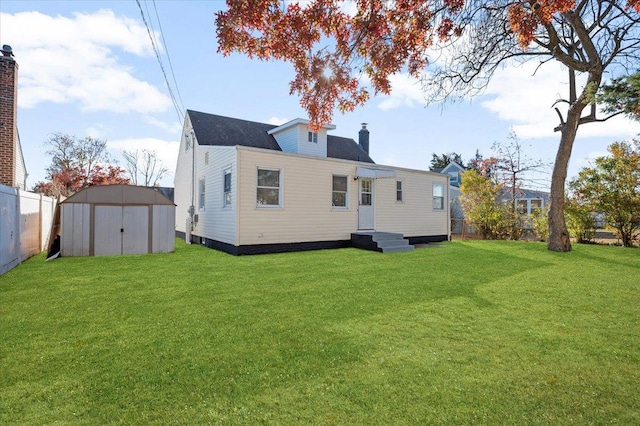 back of property featuring a lawn and a shed