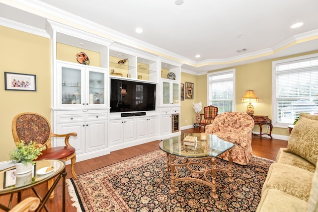 living room featuring crown molding and dark hardwood / wood-style floors