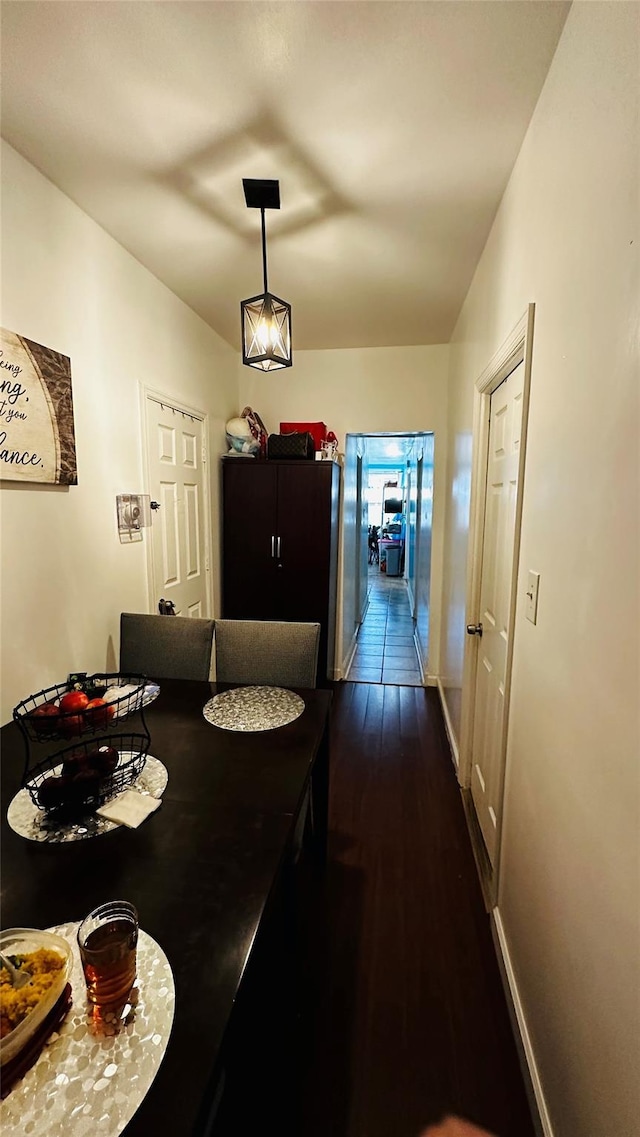 dining space featuring dark hardwood / wood-style floors