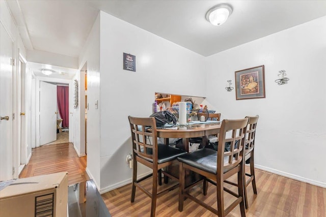 dining area with wood-type flooring