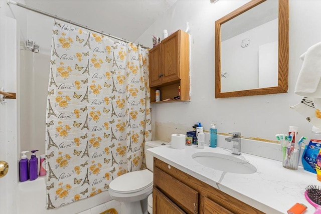 bathroom with tile patterned flooring, a shower with curtain, vanity, and toilet