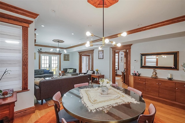 dining room with light wood-style flooring, recessed lighting, baseboards, french doors, and crown molding