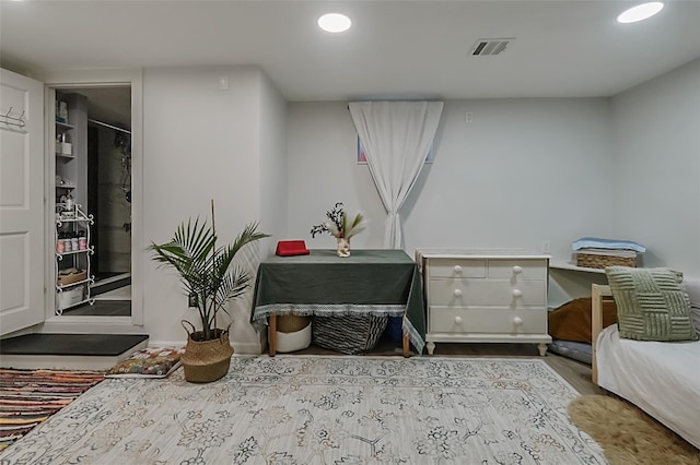 interior space with visible vents, wood finished floors, and recessed lighting