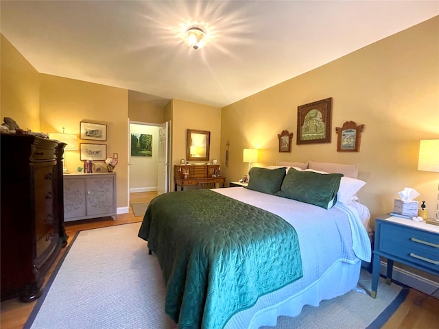 bedroom with hardwood / wood-style floors