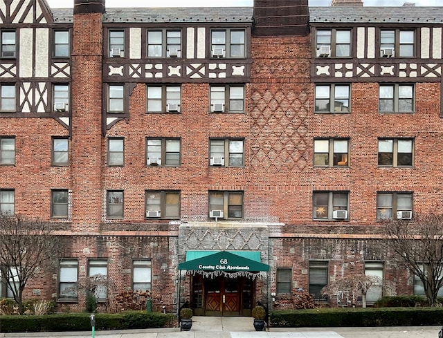 view of building exterior with cooling unit