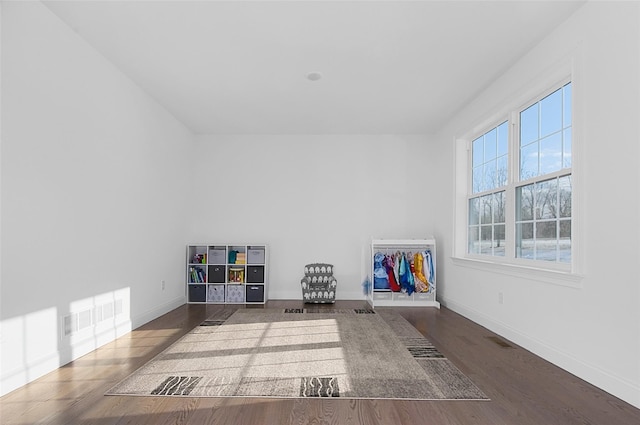 interior space with a healthy amount of sunlight and dark wood-type flooring