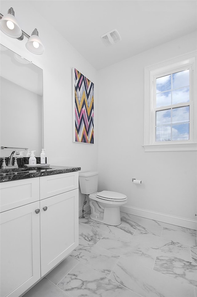 bathroom with vanity and toilet