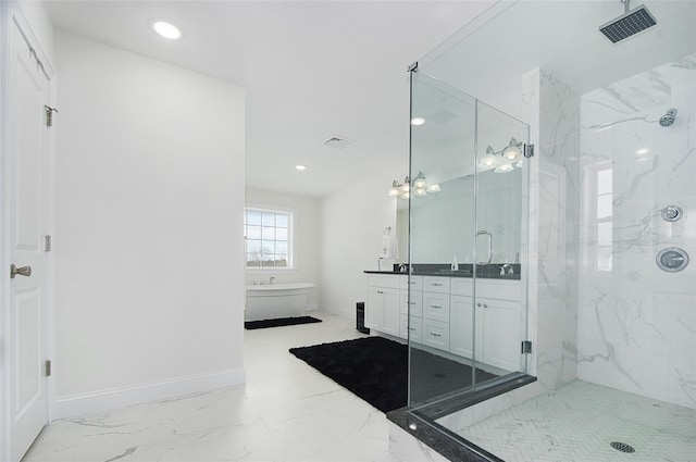 bathroom with vanity and independent shower and bath