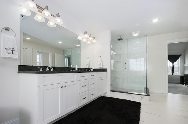 bathroom with vanity and an enclosed shower