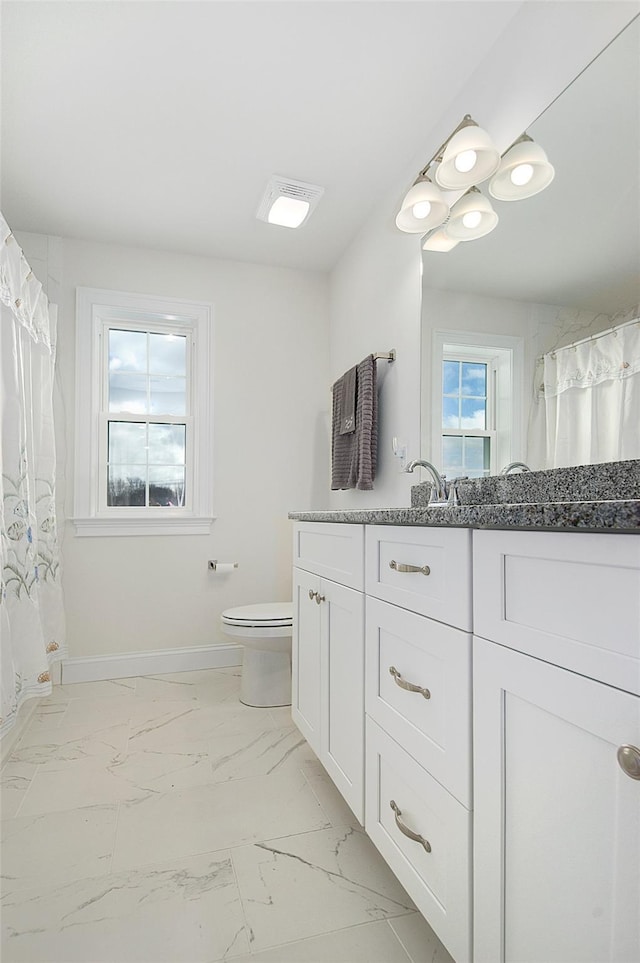 bathroom with vanity and toilet