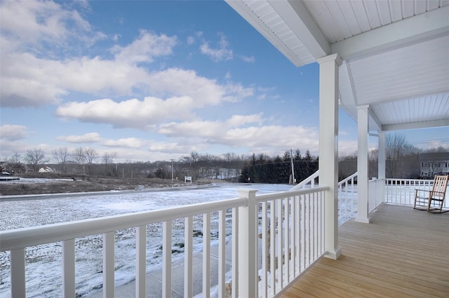 view of snow covered deck