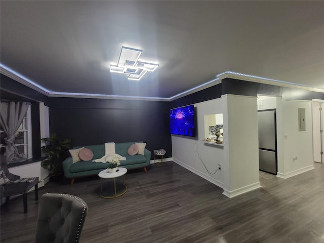 interior space featuring electric panel, wood-type flooring, and ornamental molding